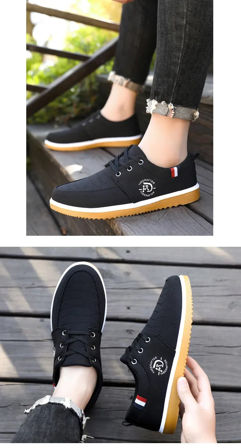 Black casual walking shoes for men with white and red accents and gum sole on wooden deck