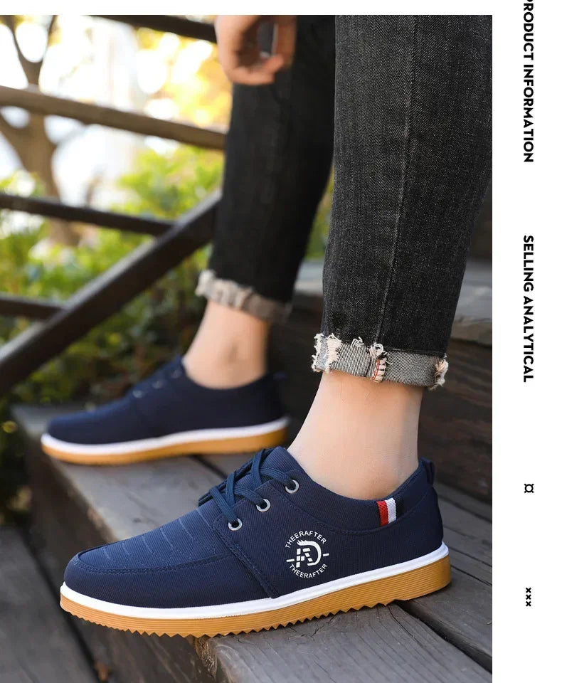 AliExpress casual walking shoes for men in navy blue with white sole worn with cuffed jeans