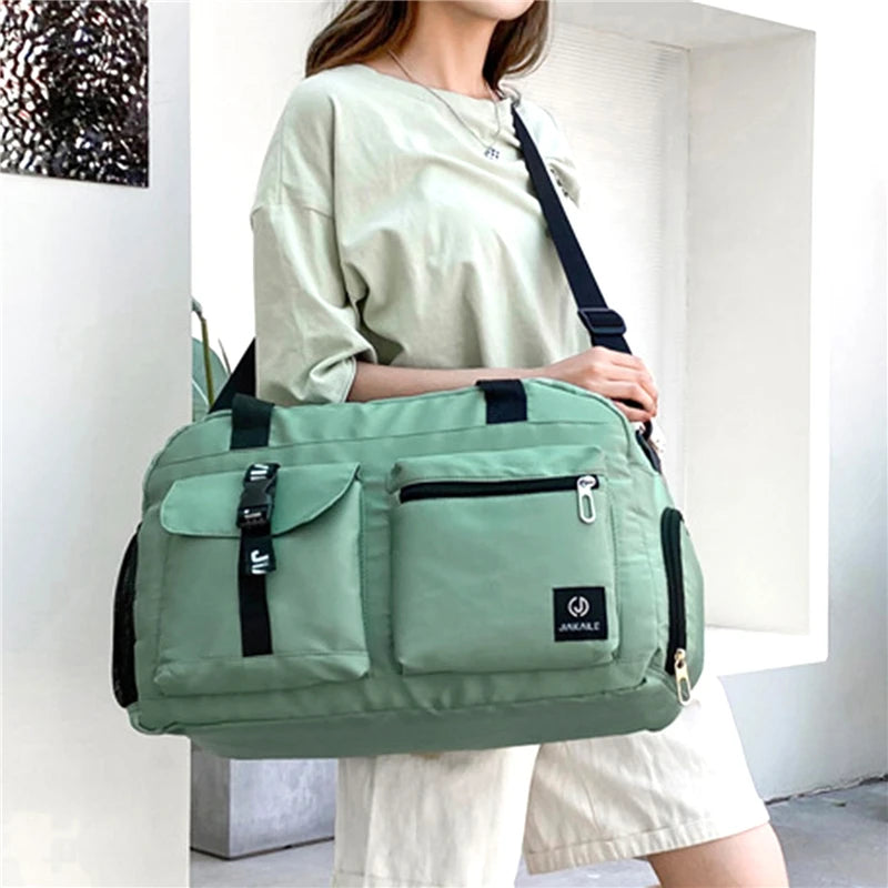 Light green women's travel handbag with multiple pockets and adjustable shoulder strap from AliExpress