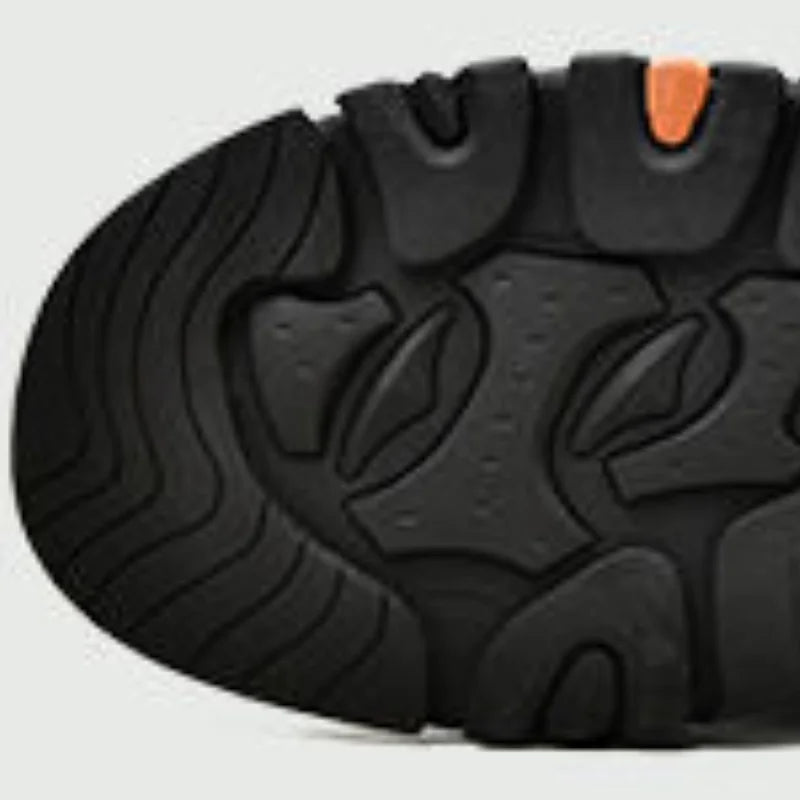 Close-up of the rugged sole of men's casual outdoor sneakers from AliExpress showing durable tread design