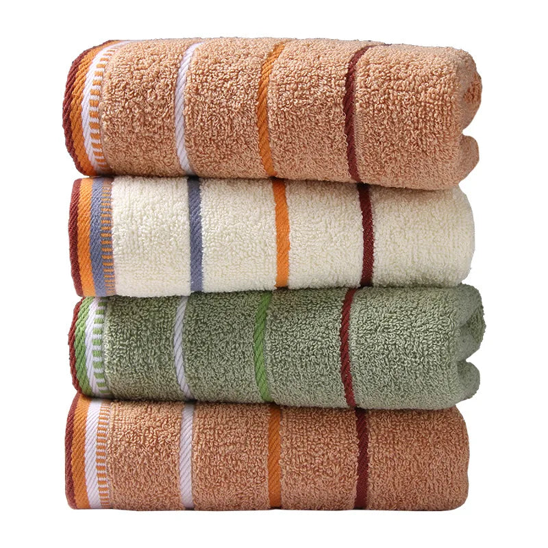 Stack of AliExpress pure cotton bath towels in brown, white, and green colors with stripe patterns