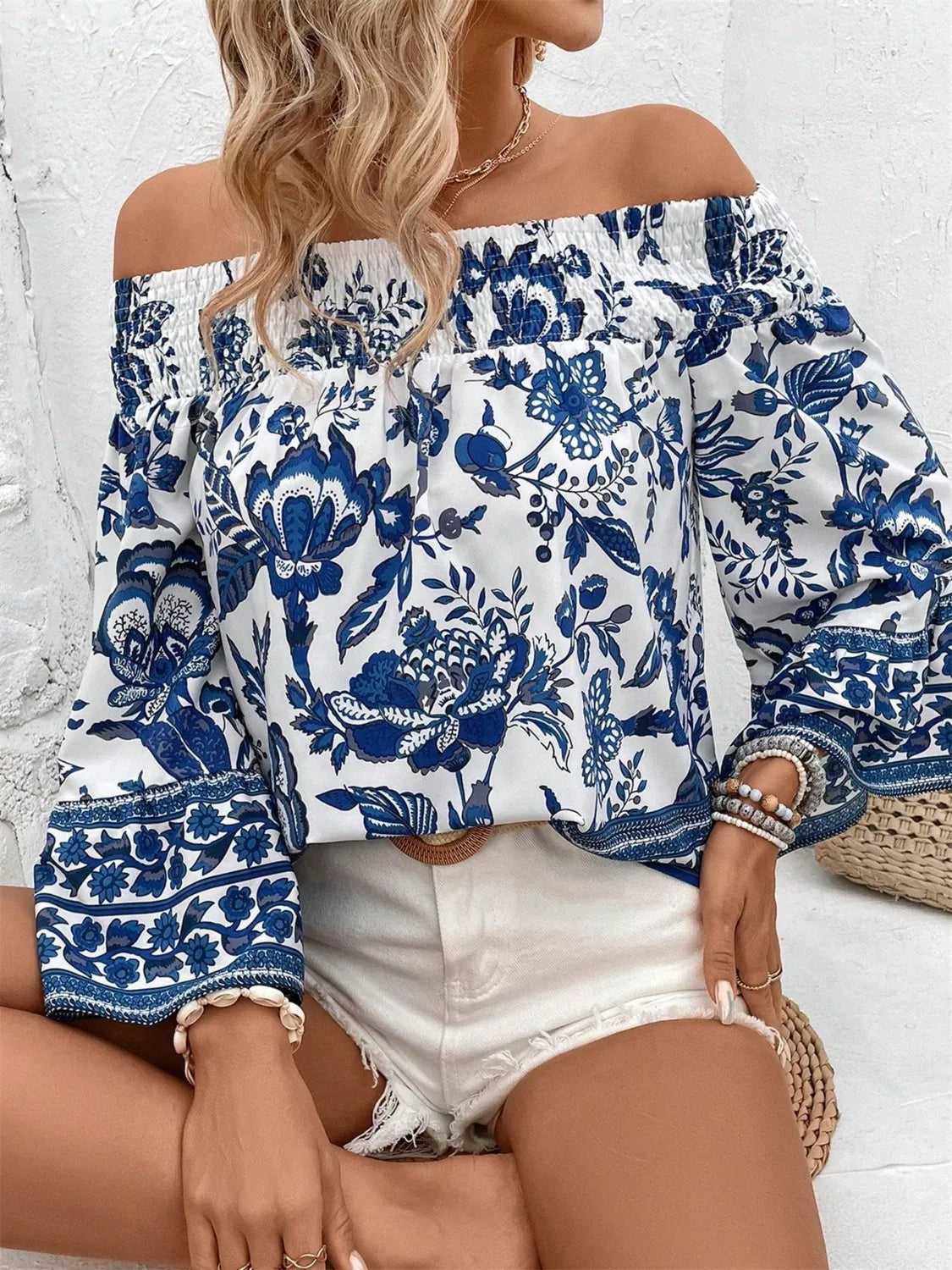 Trendsi smocked off-shoulder blouse with blue floral pattern and long puff sleeves