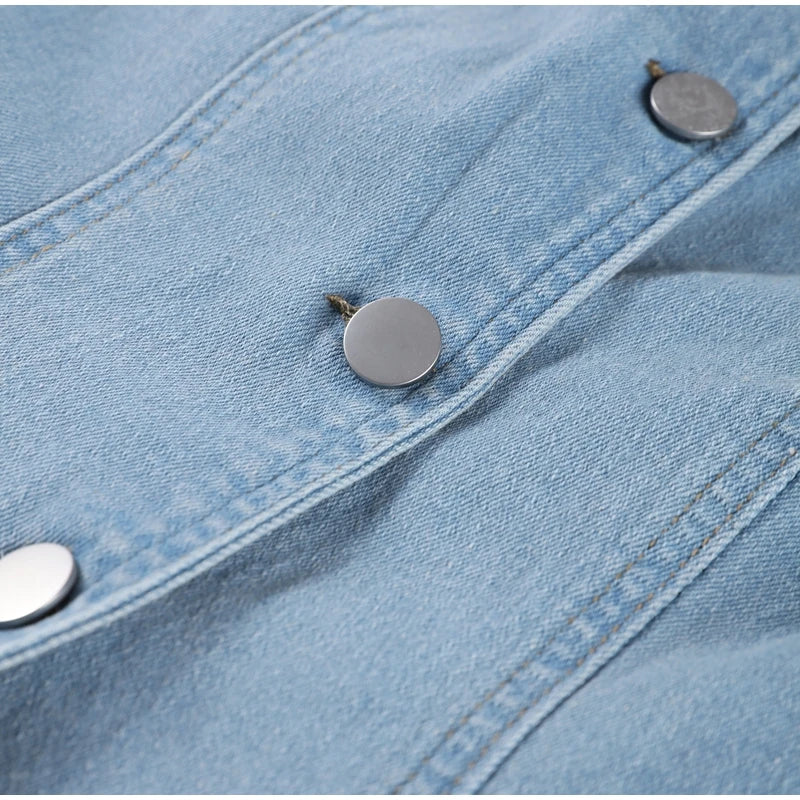 Close-up of metal buttons and light blue fabric on Maxim Trends women's jean long dress