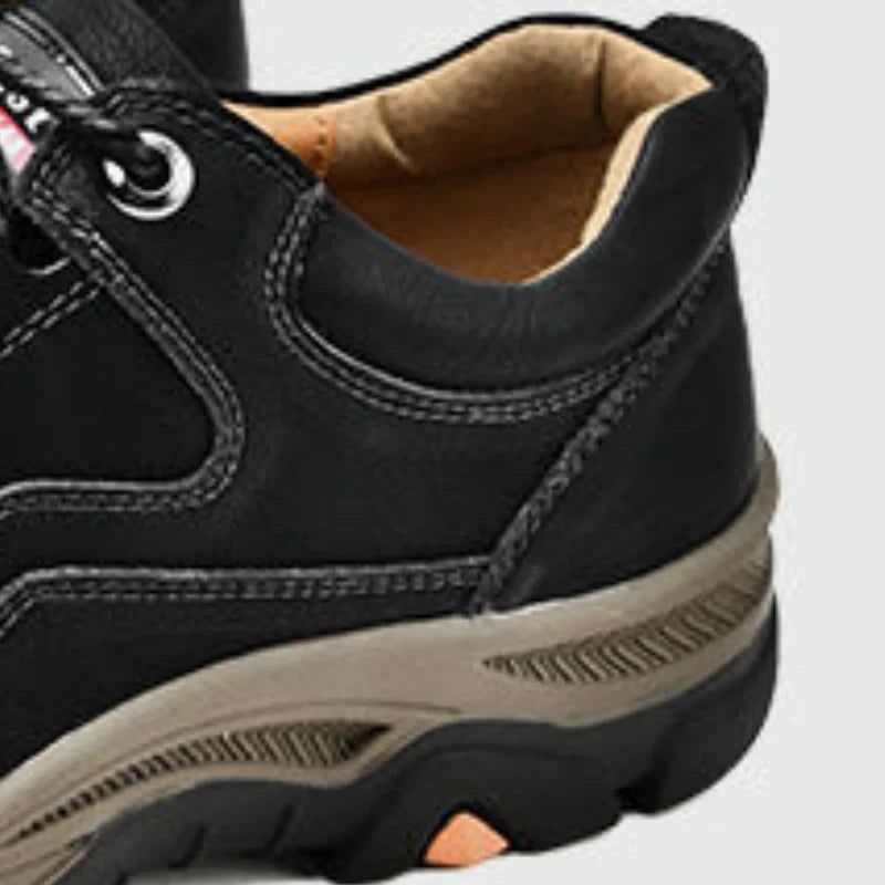 Close-up of black men's casual outdoor sneakers with durable sole and comfortable interior