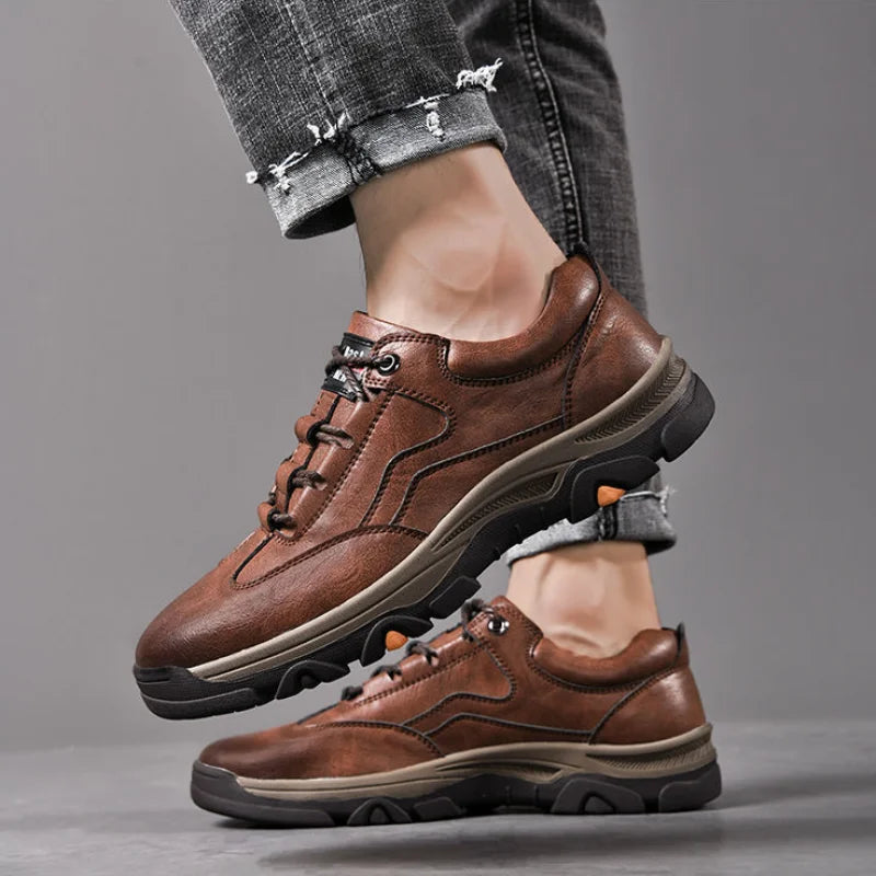Brown men's casual outdoor sneakers with lace-up design and rugged sole on model feet
